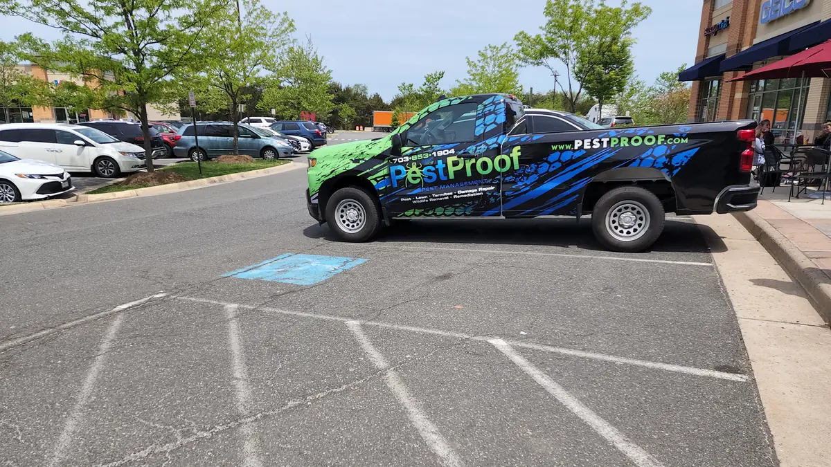 Pest Proof service van outside a commercial storefront